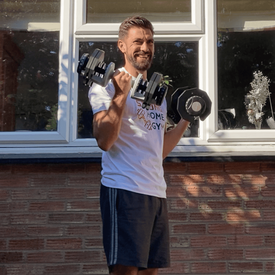 Mike using dumbbells